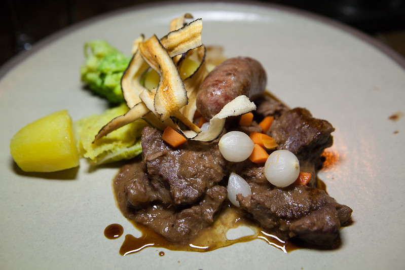 Wild boar stew, Bruut Gajes beer with boar and caraway sausage, salsify, green cabbage, romanesco, Nicola potato