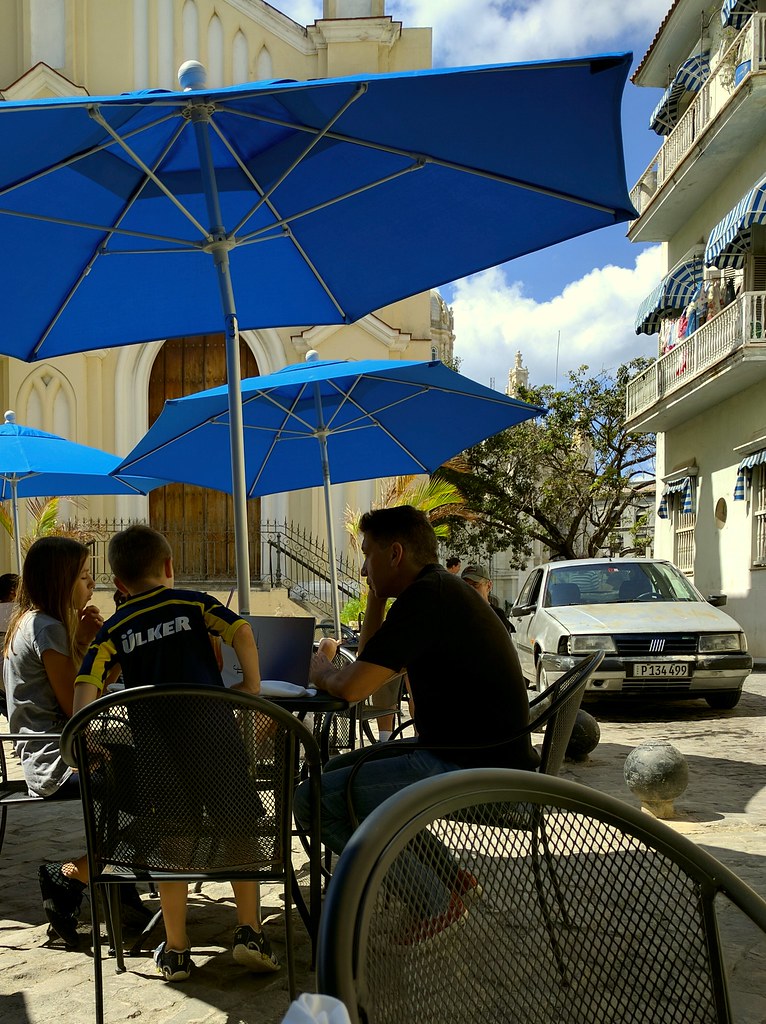 Overhearing Turkish family having breakfast beside my table near Iglesia del Santo Angel Custodio.