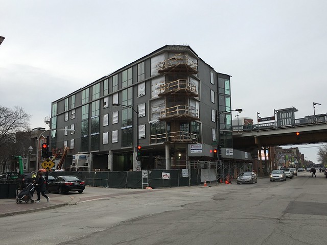 A TOD building is under construction next to the Paulina Brown Line station.