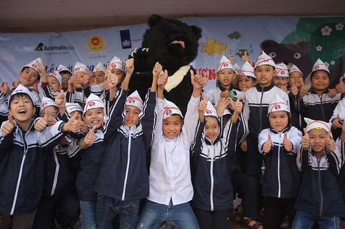 Kids thumb up to show their support for bear protection