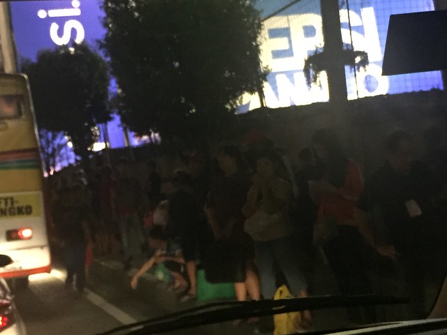 people waiting for rides to get home, EDSA