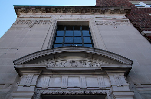 blue sky window stone first bank frieze historic national commercial classical financial rounded pediment carvings capitals 1923 cornice architrave revival beauxarts entablature arched crossettes triglyphs mutules