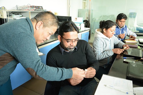ILRI's Han Jianlin with three visiting scientists at Beijing joint lab