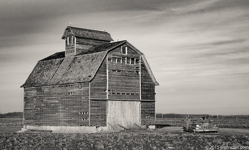 old winter blackandwhite bw copyright heritage history classic cars nature monochrome metal barn rural vintage buildings landscape illinois highway scenery iron december mechanical antique farm steel country farming rustic shed scenic structures rusty jim f10 cadillac historic il equipment machinery vehicles transportation lincoln historical farms trucks desaturated machines agriculture pastoral classiccars automobiles q3 apparatus agricultural devices frazier rochelle lincolnhighway 2015 ogle oglecounty torcwori jimfraziercom jfpblog