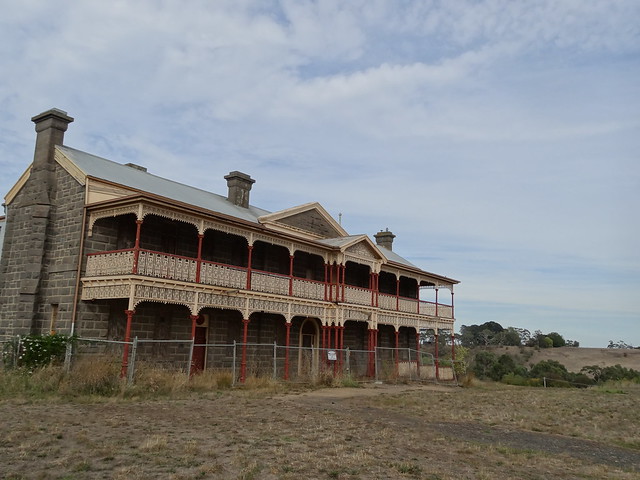 Kyneton. The old bluestone hospital built in Georgian style bewteen 1854 and 1856.  The morgue was built in 1856. East wing 1859 west wing 1874. Wrought iron veranda added 1910 destroying the Georgian appearance.