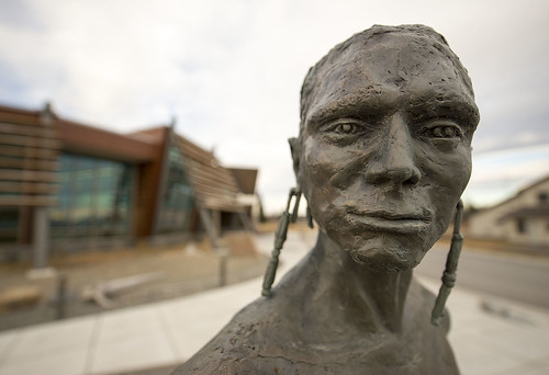 Detail from Kenaitze artist Joel Isaak's hammered bronze sculpture installation titled Luq'a Nagh Ghilghuzht (Fish Camp). The sculptures stand in front of the Dena'ina Wellness Center.