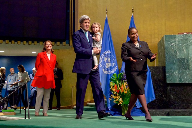 French Minister Royal Looks on as Secretary Kerry, With His Granddaughter, Walks Across the Stage to Signing the COP21 Climate Change Agreement on Earth Day in New York