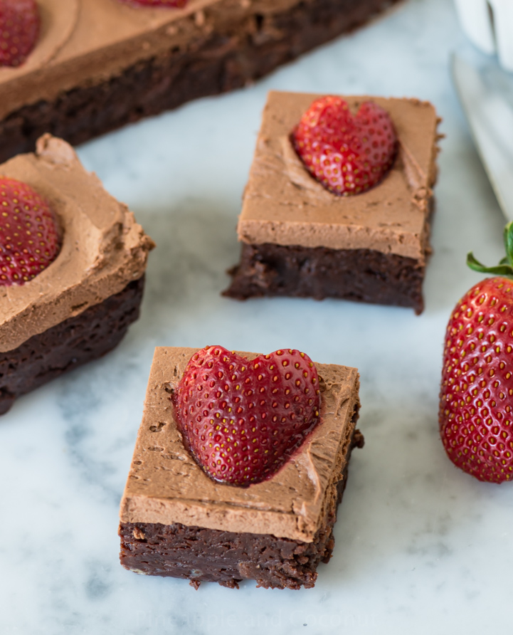 Chocolate Frosted Fudgy Brownies with Strawberrieswww.pineappleandcoconut.com