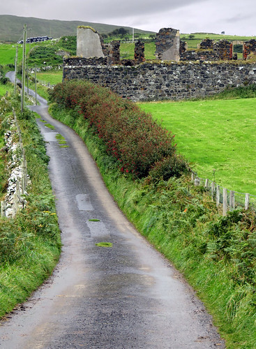 A drive along a narrow road along Torr Head Road in Ireland