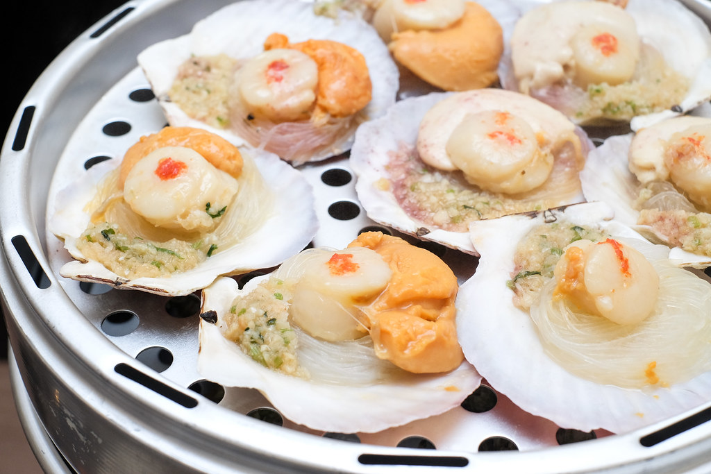 Captain K Seafood Tower's steamed scallops marinated in garlic and scallipn