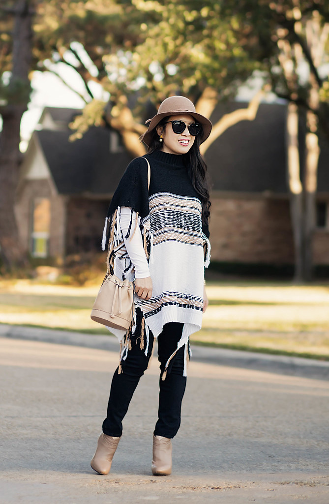 cute & little blog | petite fashion | free people labyrinth poncho, black jeans, taupe ankle boots, boho bucket bag, felt floppy hat | fall winter outfit