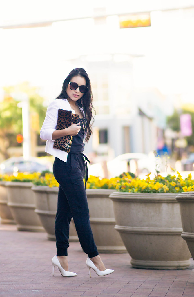 cute & little blog | petite fashion | white cropped blazer, black alala jumpsuit, white pumps, leopard clutch, layered pendant necklace, kate spade pansy earrings | spring outfit