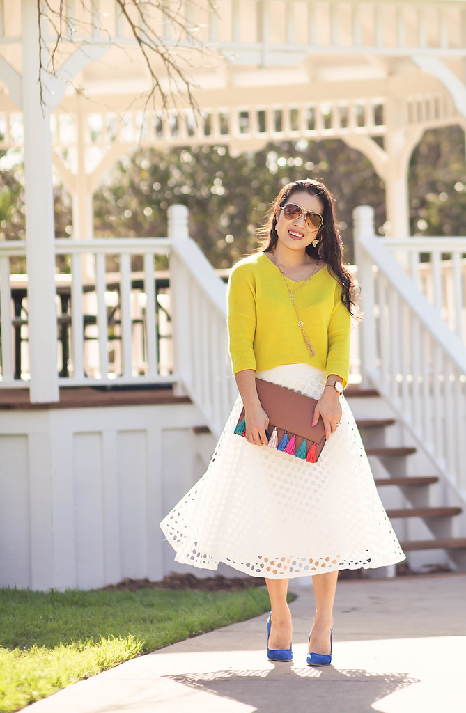 cute & little blog | petite fashion | yellow sweater, white eyelet midi skirt, minkoff sofia tassel clutch, cobalt blue suede pumps, socialite pink tassel lariat necklace, gold brown aviators, kate spade clover earrings | spring outfit