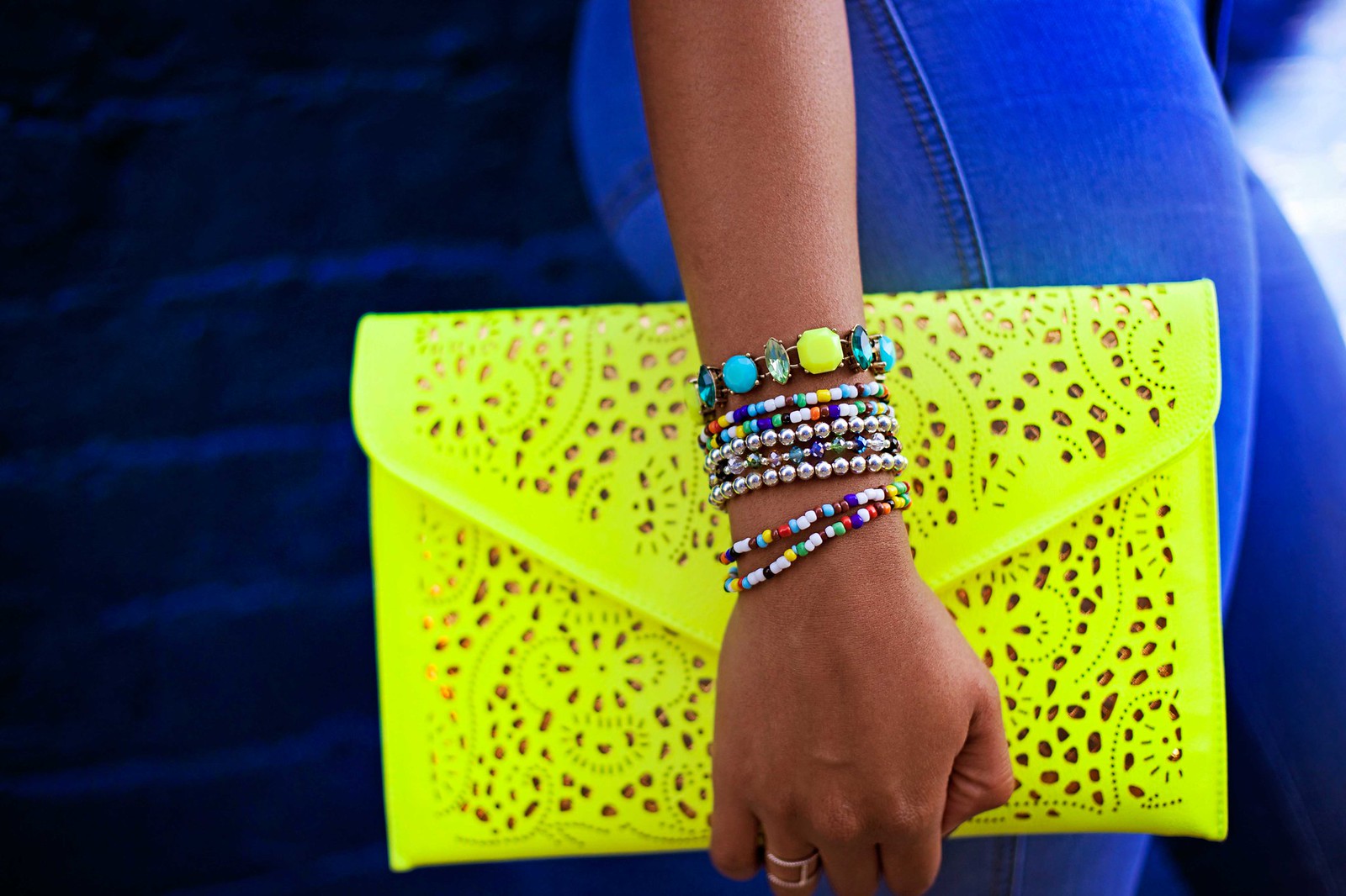how to wear an arm party, neon yellow clutch