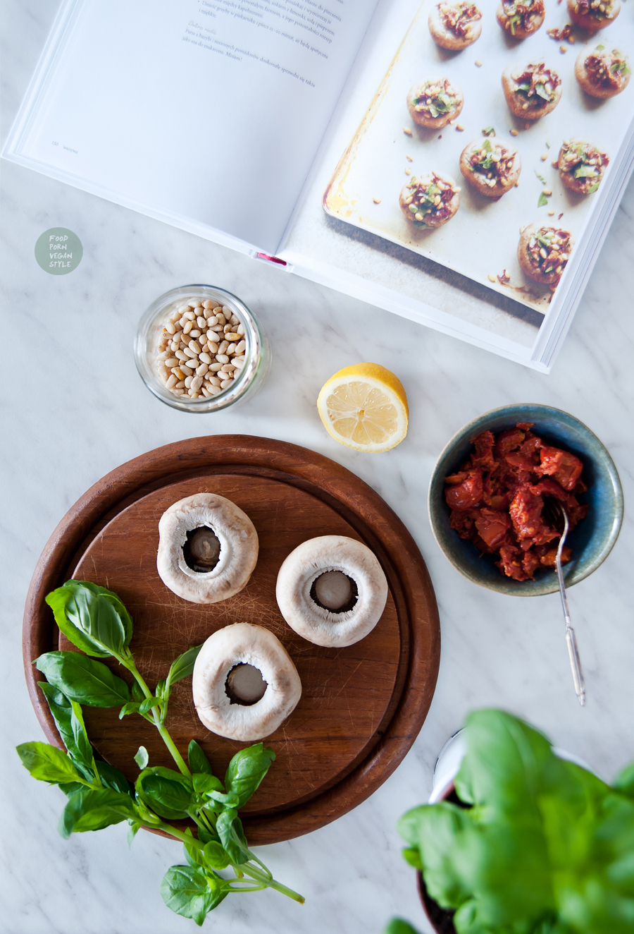 Baked stuffed mushrooms with sun-dried tomatoes, basil and pine nuts