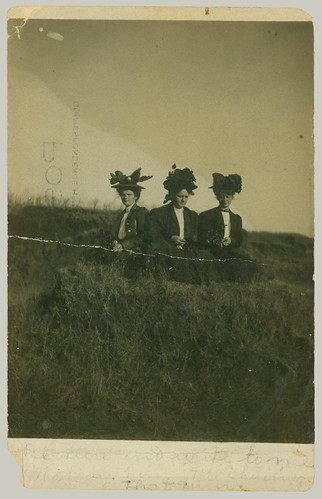 Three women with hats