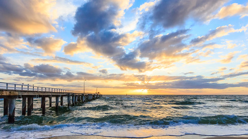 sunset sun sol beach water clouds outside outdoors coast waves coastline scapes portphillipbay