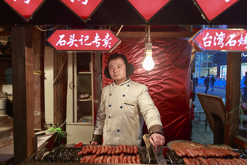 china street portrait people food man chinese sausage seller