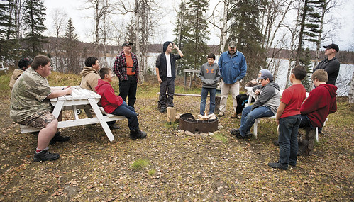 Participants in last fall’s Yaghanen Youth Programs Moose Camp gather at Spirit Lake to talk about the weekend’s plans.