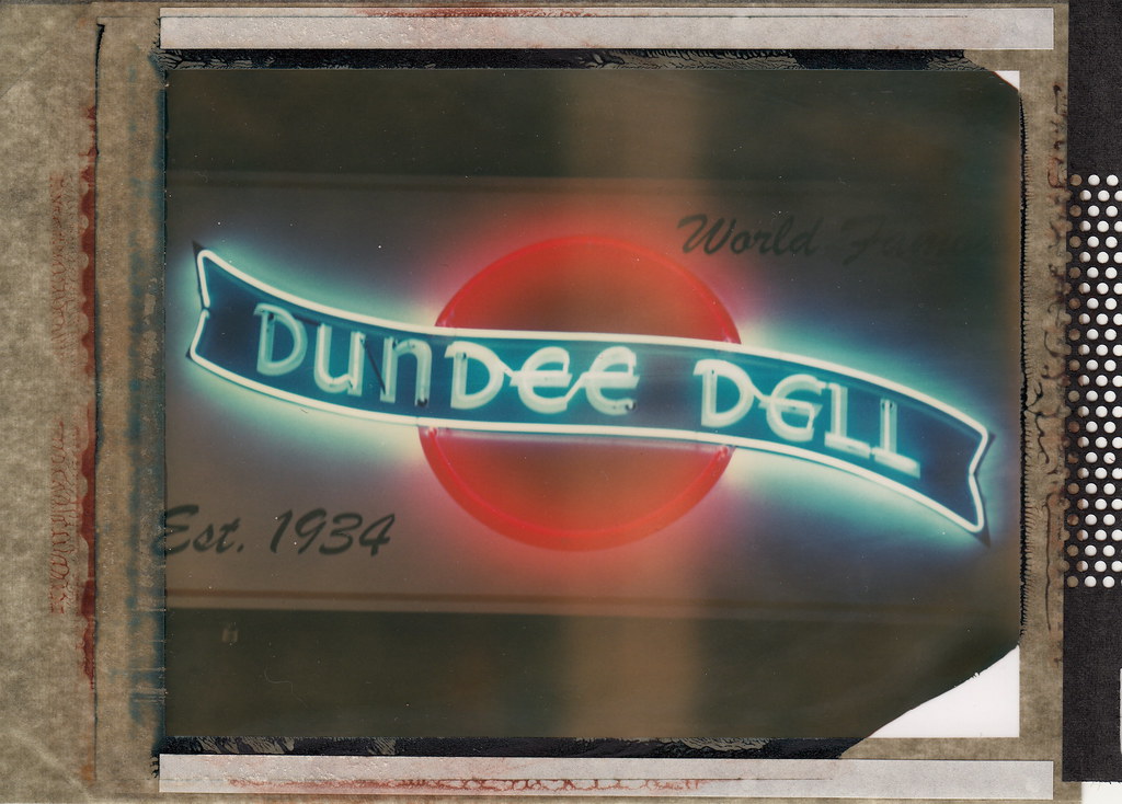 A vintage-style neon sign hangs outside of the world-famous Dundee Dell dive bar in Nebraska