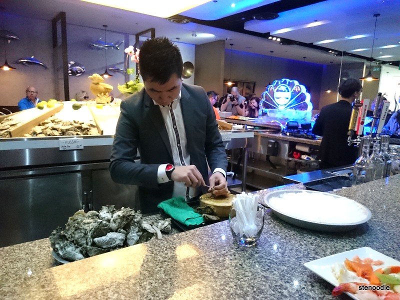 Man shucking oysters