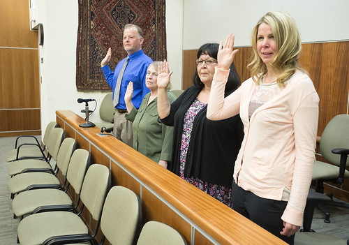 Tuckerman Babcock, Melinda Cox, Sharon Tyone and Shelli Elliott are sworn in as Court Appointed Special Advocates during a joint ceremony involving the Kenaitze Tribal Court and the Kenai Superior Court on May 2, 2014, in Kenai Superior Court.