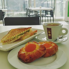 •Chicken sandwich, Danish pastry & coffee•  Location: Cerutti il Caffè  (Al Bidda Tower, Ground floor)   A peaceful place to have breakfast within the busy buzz of West Bay. Not much variety of breakfast items since it's a cafeteria, but it's w