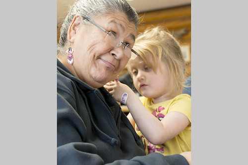 Kaydence Kline-Samson, right, looks at Barbara Kinzy's beaded ear rings at Tyotkas Elder Center. Kaydence was at the center with others from her class at the Early Childhood Center.