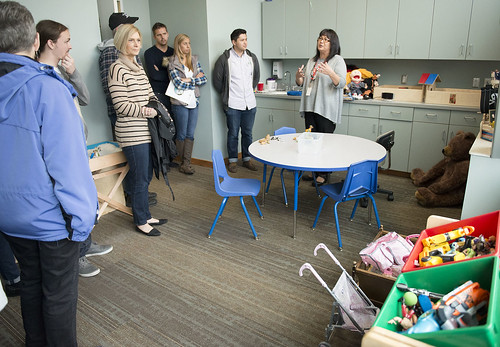 Executive Director Jaylene Peterson-Nyren, right, talks about the Behavioral Health department's play therapy room with Trustees and staff from the M. J. Murdock Charitable Trust during a tour of the center. The Trust contributed funds to help purchase fu