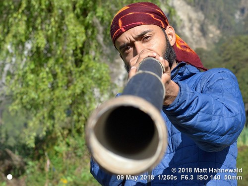 matthahnewaldphotography facingtheworld character head face eyes expression story fullbeard headwear headwrap bandana headscarf bothhands didgeridoo consent concept dedication travel culture tradition lifestyle meditation music cultural mountains traveller melamchigaon helambu nepal asia himalayas asian indian individual oneperson male young man photo detail nikond3100 primelens 50mm 4x3 horizontal street portrait halflength fulllength closeup seveneighthsview lowangle outdoor morning color posing iconic awesome authentic musicalinstrument blowing playing shiva buddha nikkorafs50mmf18g lookingcamera