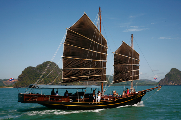 Thai junk sailing past the Phi Phi Islands in southern Thailand.