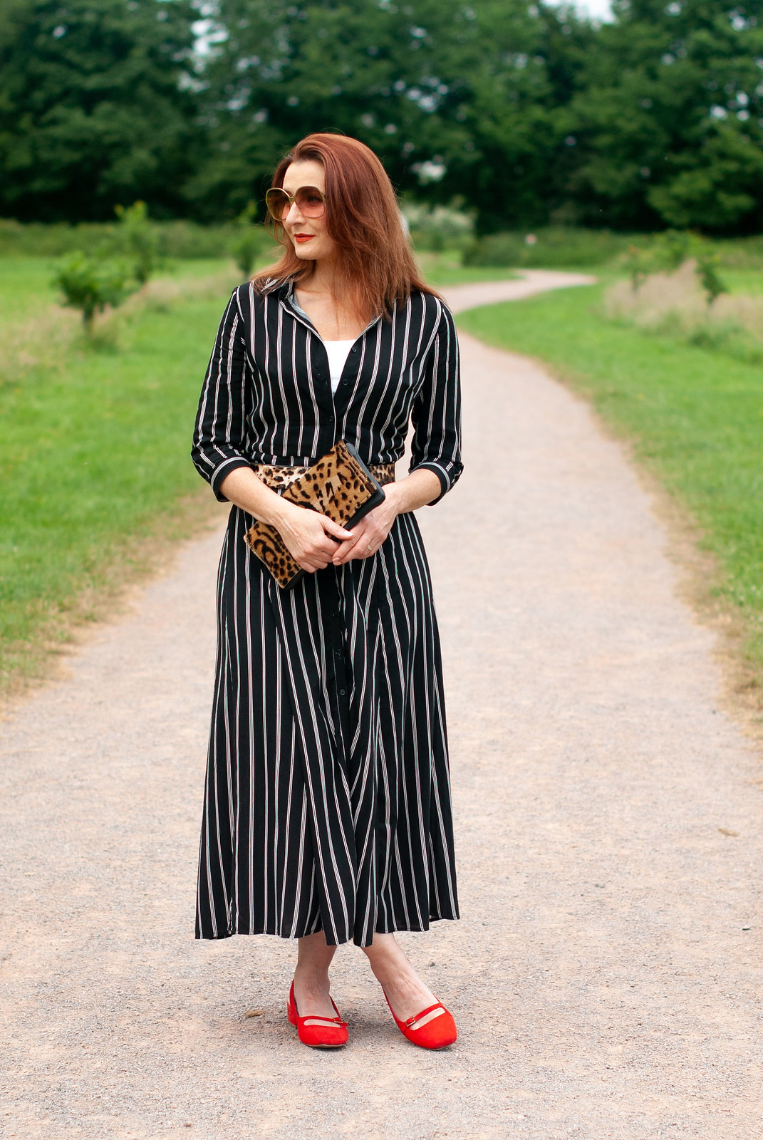 How to Style a Summer Shirt Dress With Pattern Mixing \ black and white striped midi shirt dress \ leopard clutch and belt \ red slingback block heel shoes | Not Dressed As Lamb, over 40 style