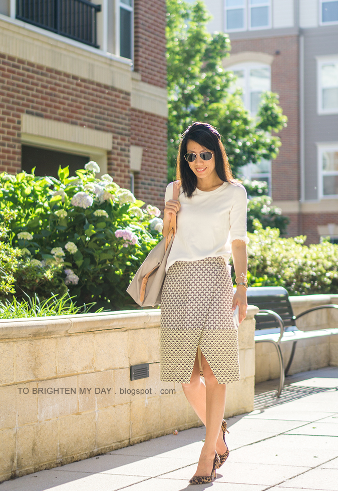 white fringe sweater tee, gold watch, floral cuff, jacquard wrap skirt, nude and gray tote, leopard pumps