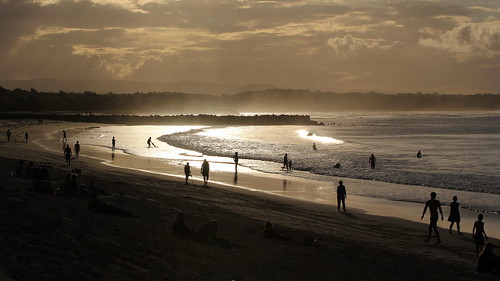beach ocean sea sunset people queensland australia