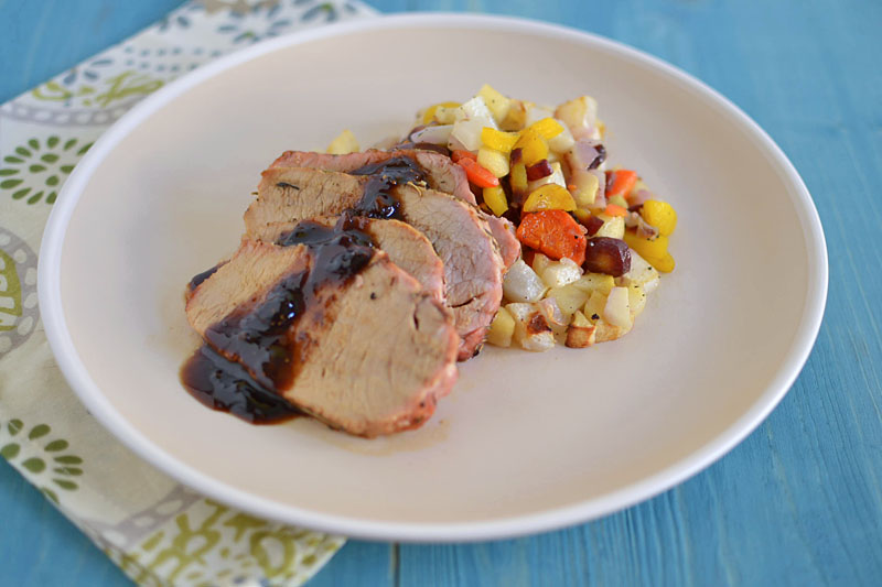 An easy and gorgeous dinner with herbes de Provence roasted pork loin, caramelized root vegetables and a sweet and savory balsamic reduction.