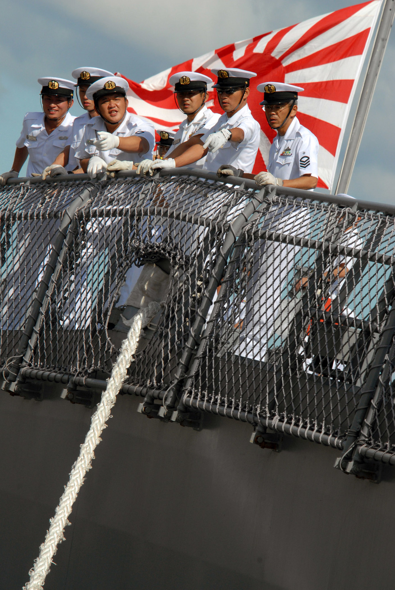 Japanese sailors on board JS KONGO (DDG 173) watch pier-side line handlers as the ship moors pierside Naval Station Pearl Harbor. Currently in Pearl Harbor, KONGO is the first Japanese ship with the capability to detect, track and intercept short to medium range ballistic missiles. Later this year, KONGO will conduct a flight test, designated Japan Flight Test Mission-1, at Pacific Missile Range Facility, Hawaii. U.S. Navy photo by Mass Communication Specialist 1st Class James E. Foehl (RELEASED)