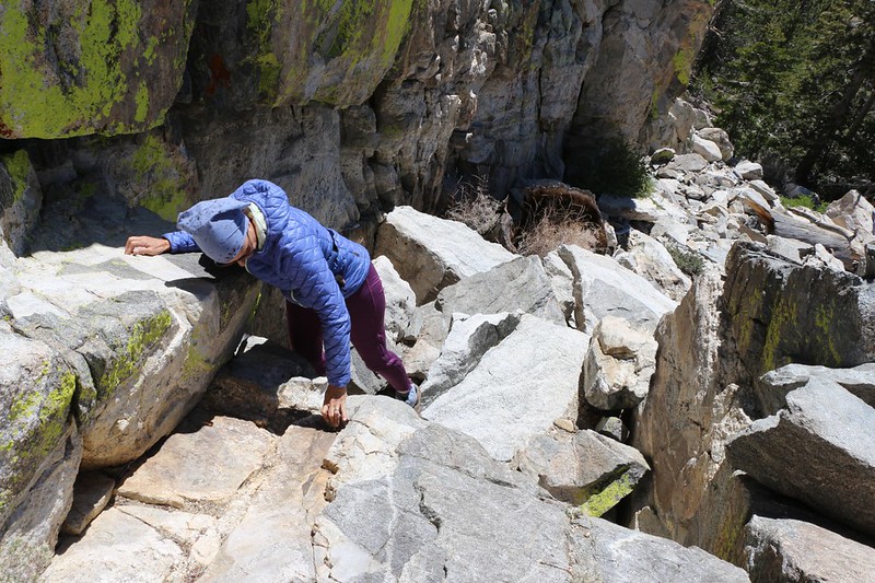 Down-climbing the steep granite chute on the northwest face of Yale Peak