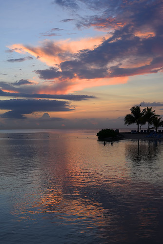 jamaica westindies caribbean mobay montegobay beautiful pretty lovely gorgeous sunset evening clouds sky water ocean caribbeansea ripples reflections palmtrees peopleswimming sundaylights peaceful tranquil placid