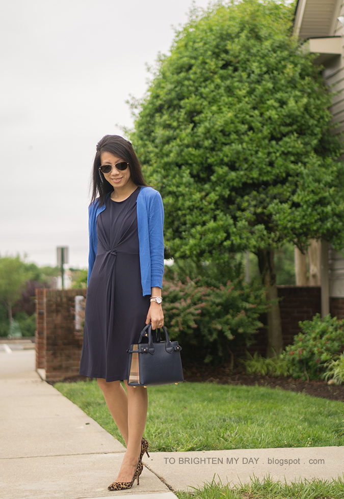 bright blue cardigan, navy twisted front knit dress, navy tote, two tone watch, leopard pumps