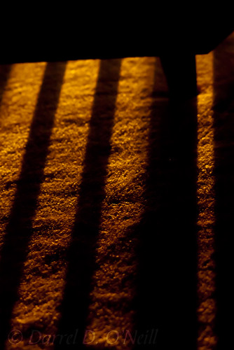 shadow railing pickets spindles carpet floor sunrise glowing black orange red yellow morning stlouis fairviewheights illinois usa minimalism minimalist abstract