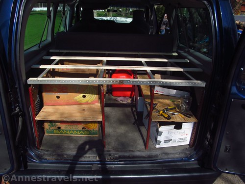 The mostly-finished shelving unit in the back of the Ford E150 van - the only thing missing is the top deck! (Well, that and most of the boxes!)