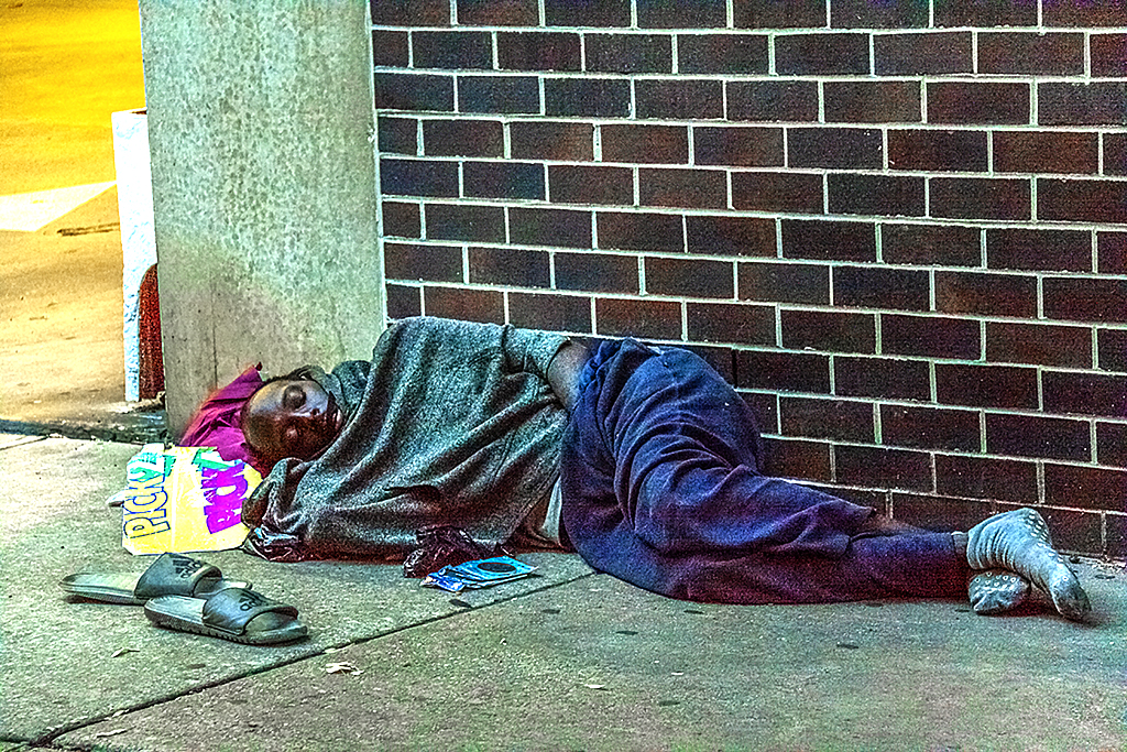 Homeless man outside garage at 11th and South--South Street