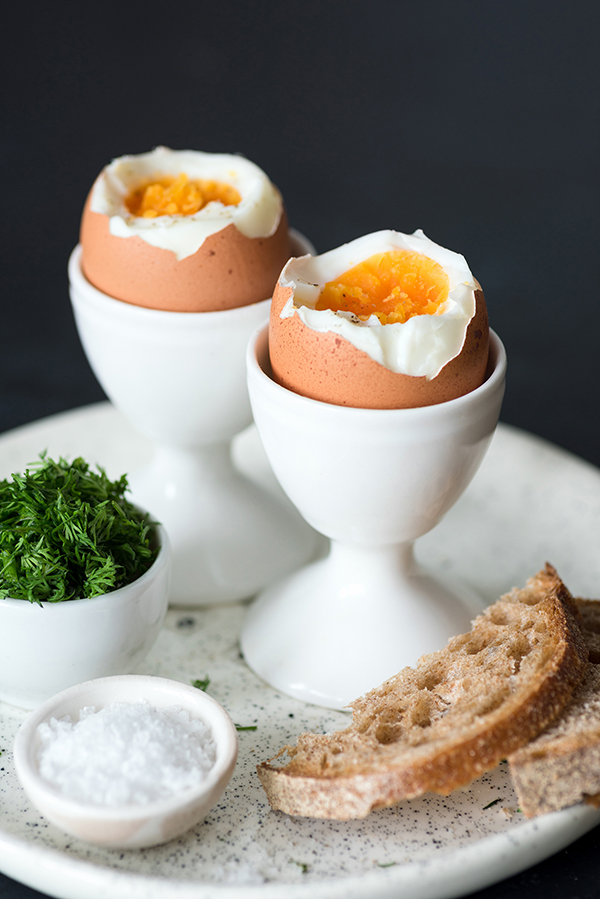 Boiled eggs with sea salt and toasted bread for breakfast
