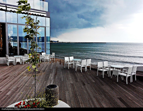 sea sky storm picture perfect frame restaurant chairs tables building glass parquet wood modernism day blacksea blue colors furniture water wind air view out photographer shades reflections art photography new