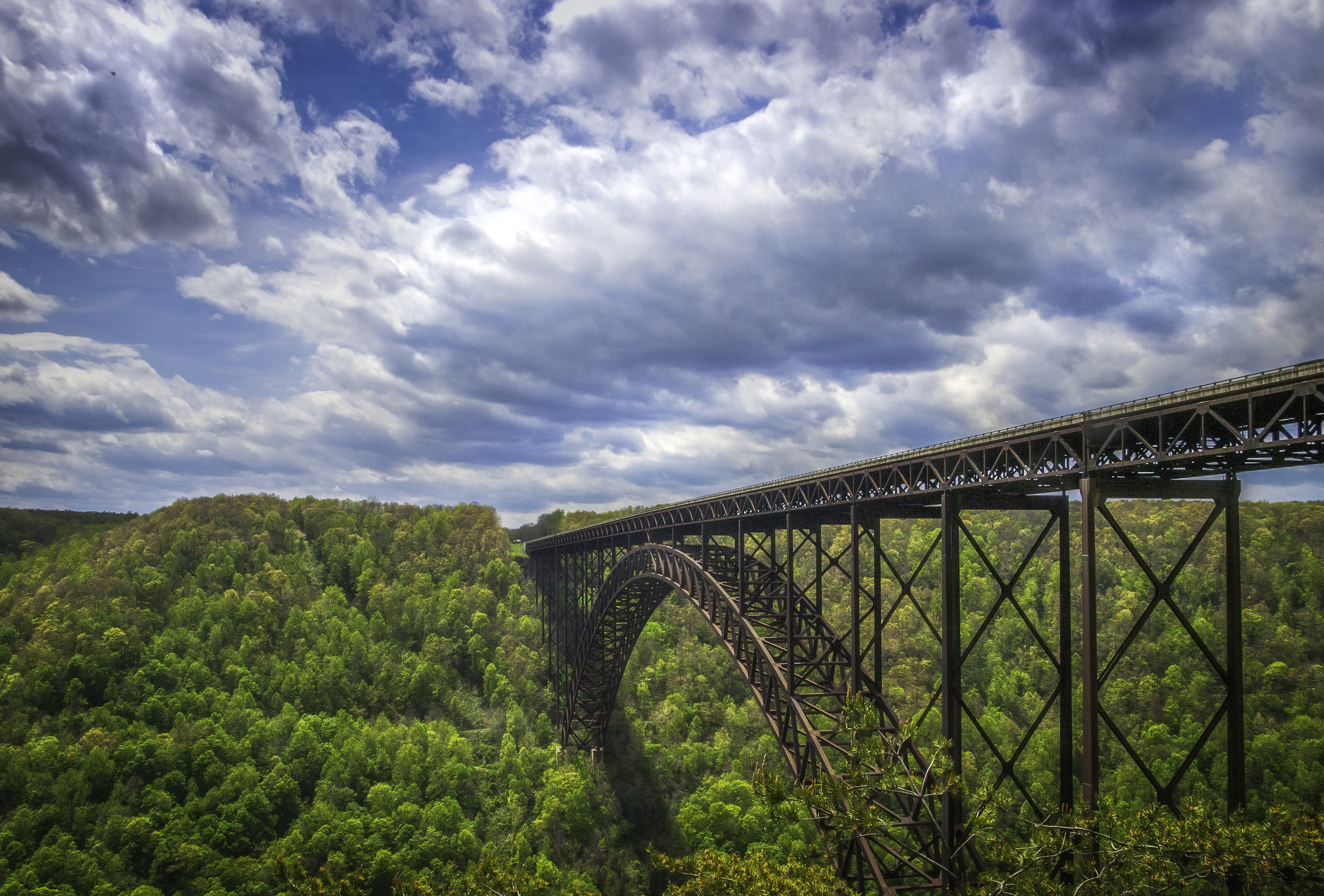 View of the New River Gorge Bridge from the overlook at the north end of the New River Gorge (facing southwards), near Fayetteville, West Virginia. Taken May 5, 2013 using an Olympus E-3 DSLR by Shawn Ullerup.