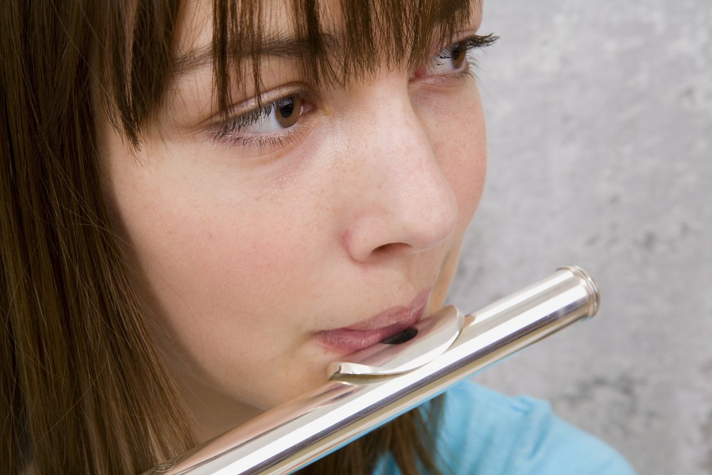 young flute player practicing