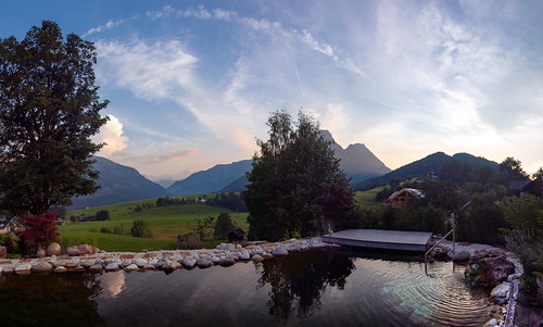 austria styria ausseerland landscape sunset sky clouds mountains pool water tree panorama scenery