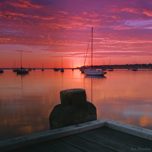 dawn sunrise seascape pier bay yacht boat clouds color pink australia coastal
