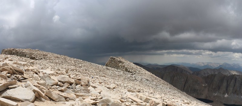 The clouds keep getting darker but we're still in the sun as we descend from Mount Whitney on the JMT