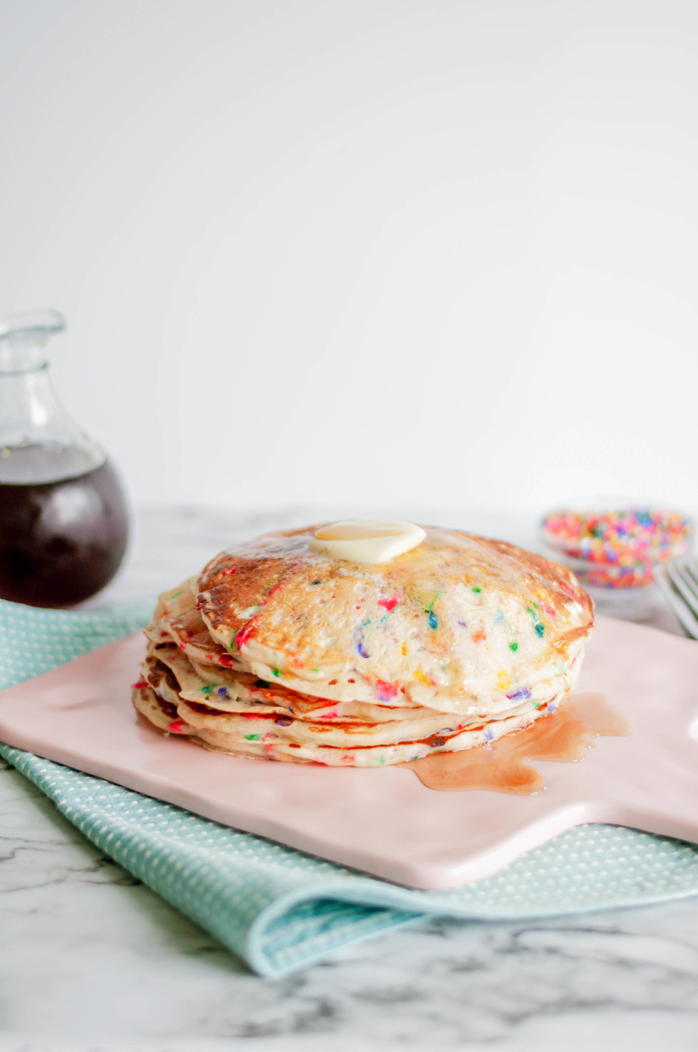 Funfetti Pancakes are a fun way to celebrate something special or brighten that Monday mood. Packed full of sprinkles and cake batter goodness.